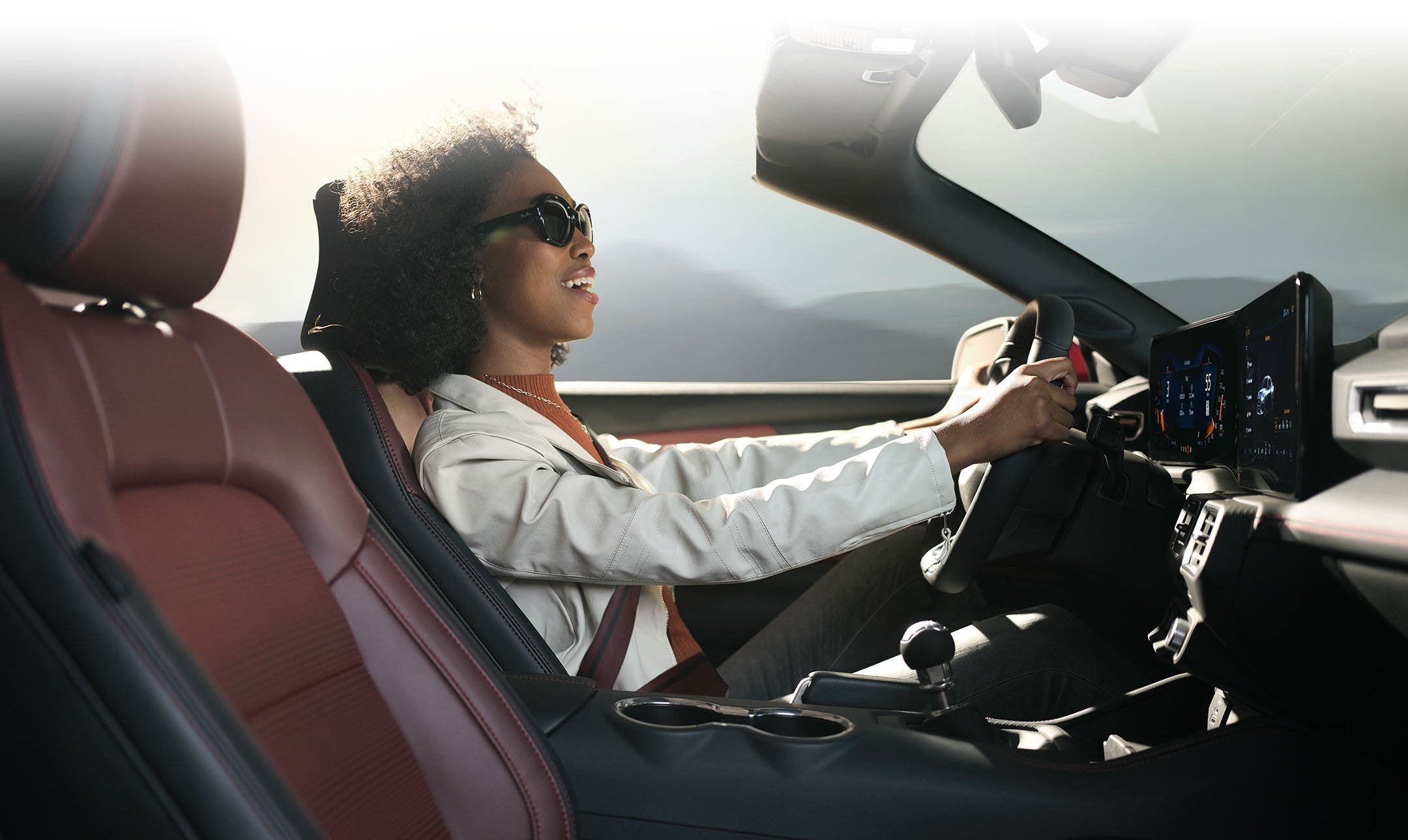 Person sitting in the driver’s seat of a 2024 Ford Mustang® convertible | Joe Ricci's Ordus Ford, LLC in Bad Axe MI