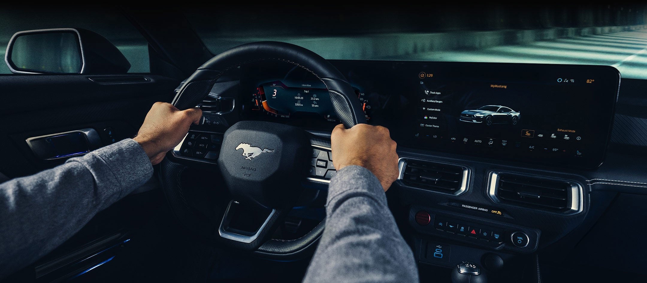 A 2024 Ford Mustang® model interior with a person driving | Joe Ricci's Ordus Ford, LLC in Bad Axe MI